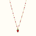 DUGO strawberry charm necklace with a red pendant on a gold-tone chain featuring small red bead accents