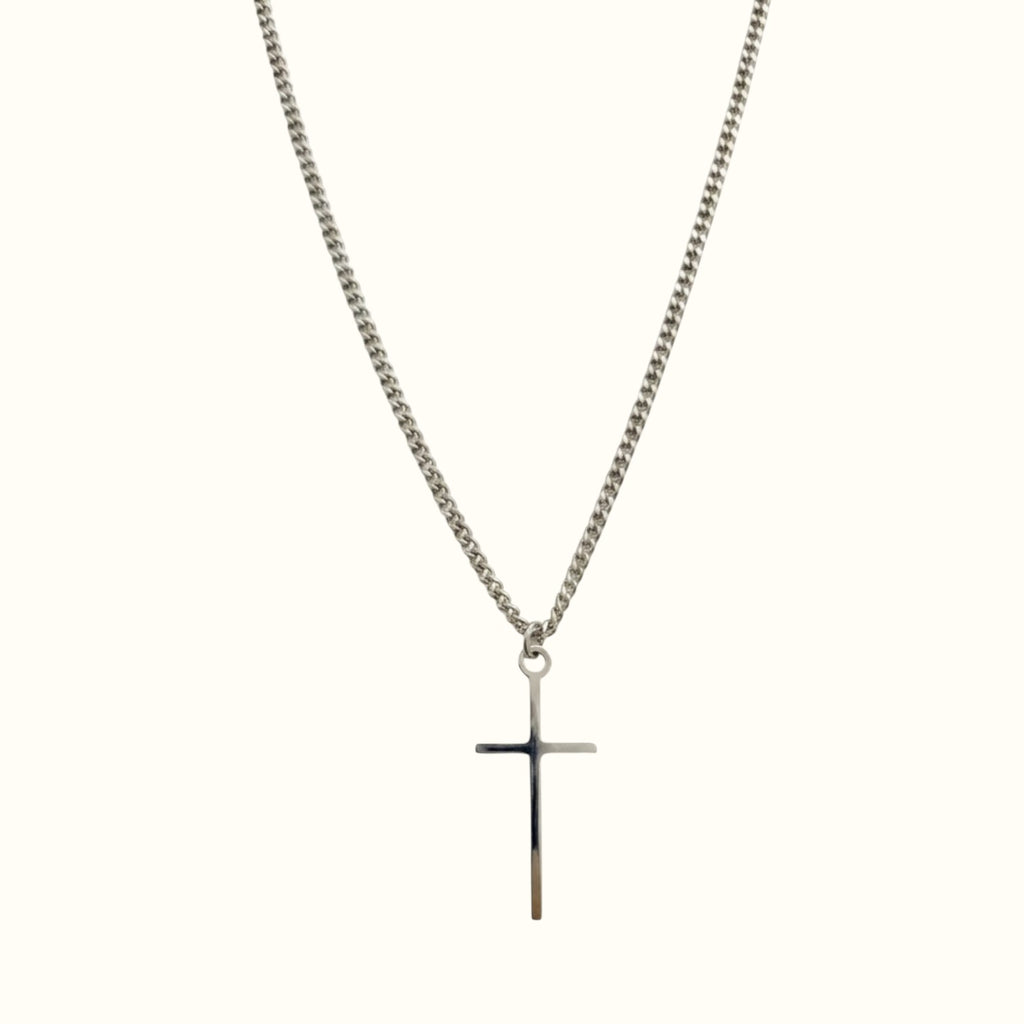 DUGO Cross Tiny necklace featuring a minimalist silver-tone cross pendant on a delicate curb chain