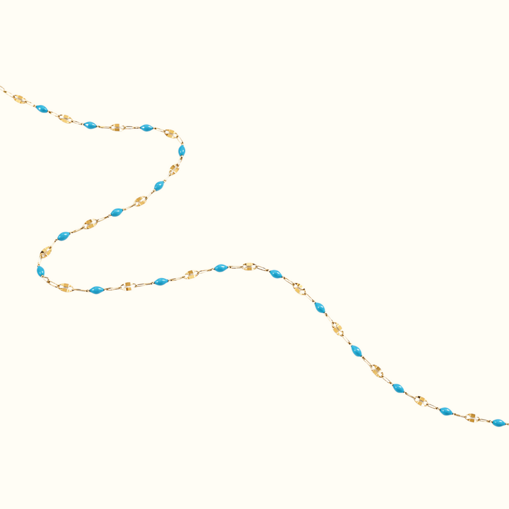 DUGO dainty gold chain bracelet featuring vibrant turquoise enamel oval beads in a minimalist stacking design